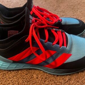 Adidas Adizero Ubersonic sneakers.